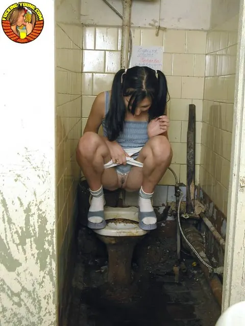 Pigtailed Woman Squats to Pee on Toilet in Socks – photo 9 of 20