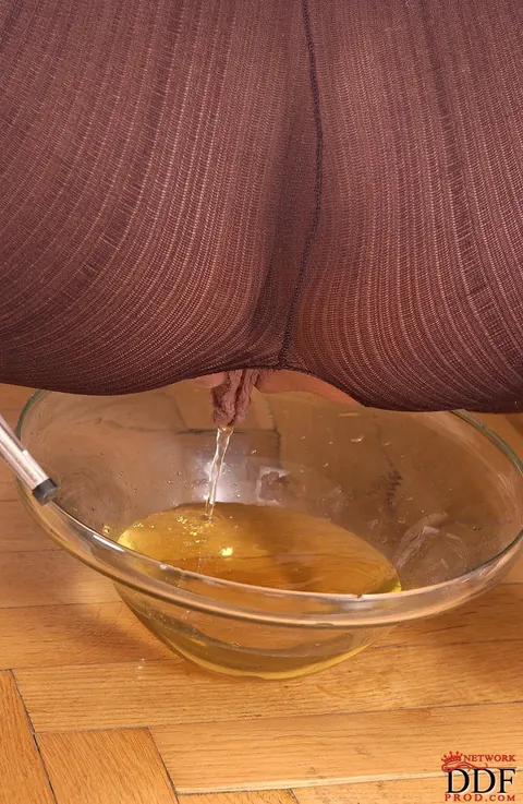 European PAWG Pisses into a Glass Dish in Crotchless Bodystocking – photo 16 of 16