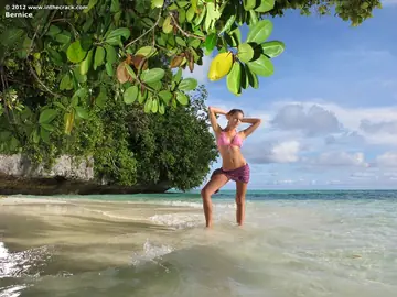 Woman in a Bikini and Skirt Masturbates with a Dildo on the Beach