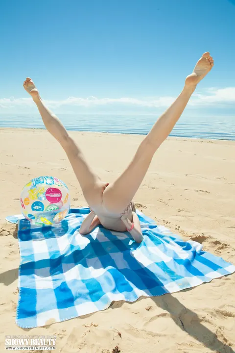 Blonde with Natural Tits Spreads Her Shaved Pussy on a Beach Blanket – photo 18 of 20