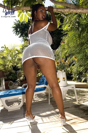Busty Ebony MILF Oils Her Big Ass in Lingerie Outdoors