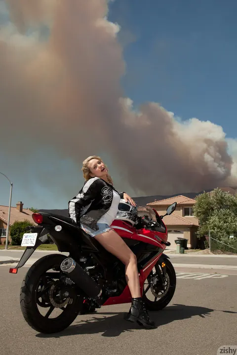 Mia Malkova: Busty Blonde in Glasses Poses in Denim Shorts on a Motorcycle – photo 6 of 11
