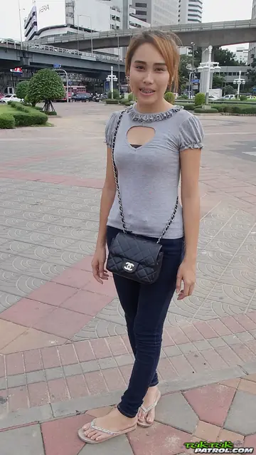 Thai Woman Strips Out of Her Jeans and Spreads Her Trimmed Pussy on the Bed