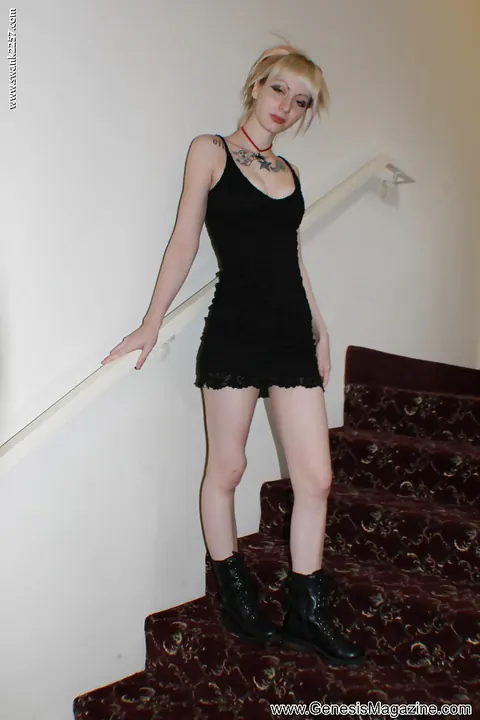 Tattooed Blonde Babe Poses in a Black Dress and Boots – photo 13 of 16
