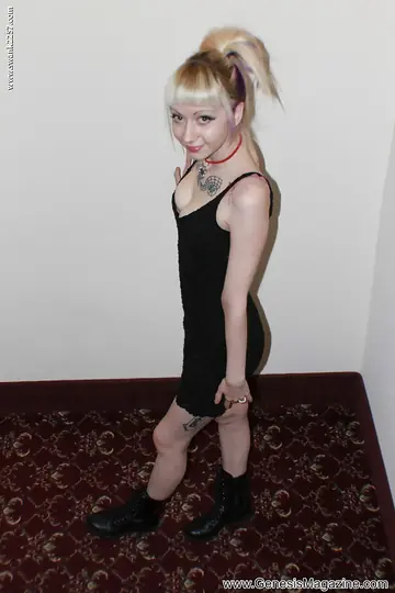 Tattooed Blonde Babe Poses in a Black Dress and Boots