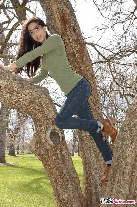 Bella Quinn: Thick Latina Brunette Climbs a Tree in Jeans and Sweater Outdoors – photo 9 of 12
