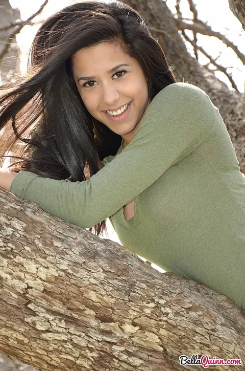Bella Quinn: Thick Latina Brunette Climbs a Tree in Jeans and Sweater Outdoors – photo 8 of 12