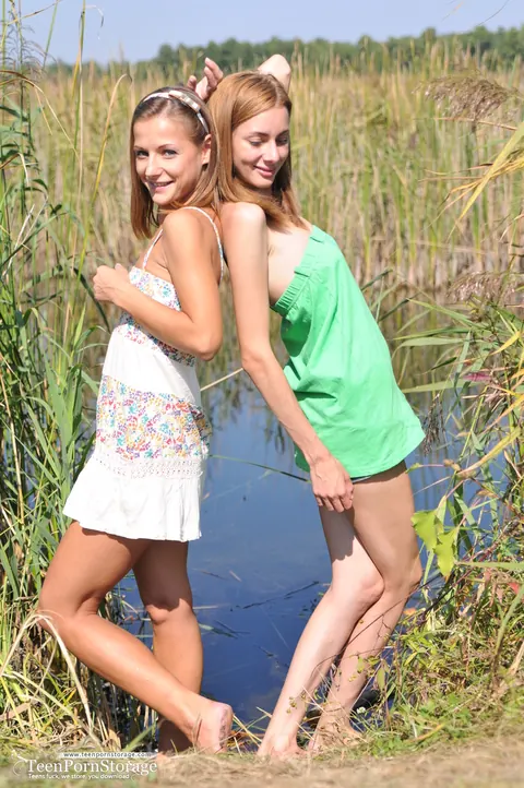 Two Slim Women Strip Skirts and Eat Pussy on a Dock – photo 2 of 20