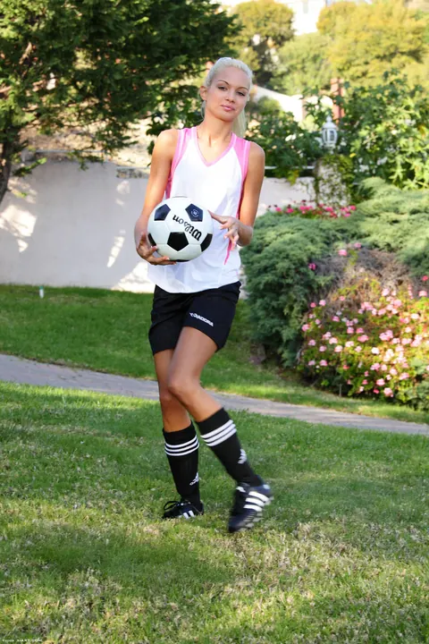 Franziska Facella: Skinny Blonde Poses with a Soccer Ball in Shorts Outdoors – photo 5 of 16