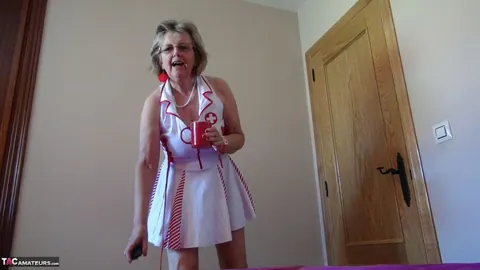 Mature Nurse in Glasses Frees Her Tits and Rides a Dildo – photo 2 of 20