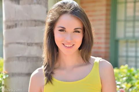 Emily Grey: Slim Brunette Strips Out of Her Yellow Dress Outdoors – photo 2 of 16