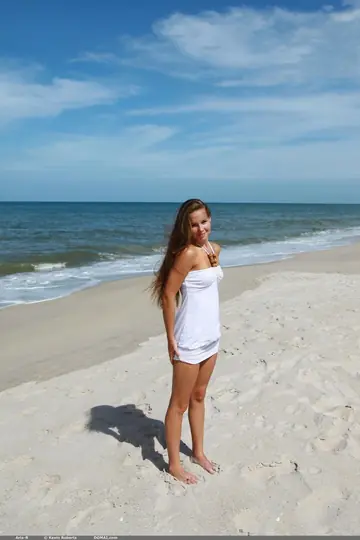 Slim Petite Woman Spreads Her Pussy on the Beach