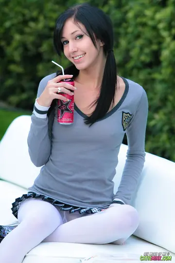 Slim Brunette in Pantyhose Spreads Her Shaved Pussy Outdoors