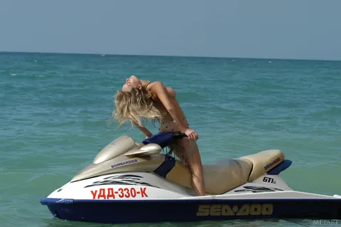 Busty Woman Exposes Her Tits on a Water Scooter Outdoors – photo 2 of 18