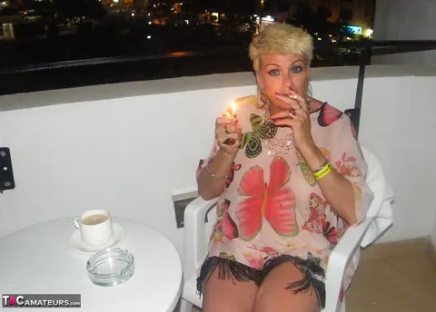 Mature Blonde with Big Tits Strips Naked on the Balcony – photo 3 of 20