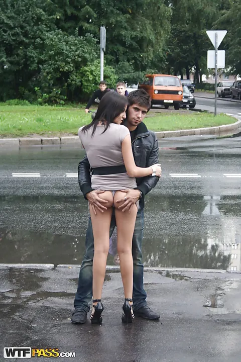 Brunette in a Skirt and High Heels Shows Her Ass by the Car Outdoors – photo 15 of 16