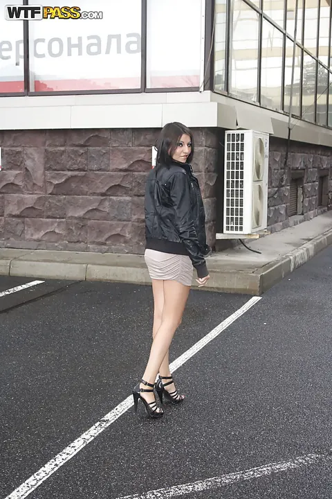 Brunette in a Skirt and High Heels Shows Her Ass by the Car Outdoors – photo 3 of 16