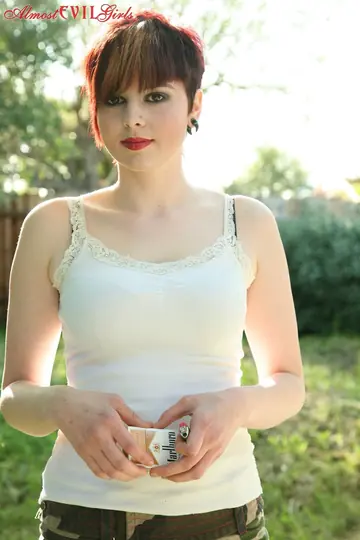 Short-Haired Woman Reveals Her Tits and Pussy in the Garden
