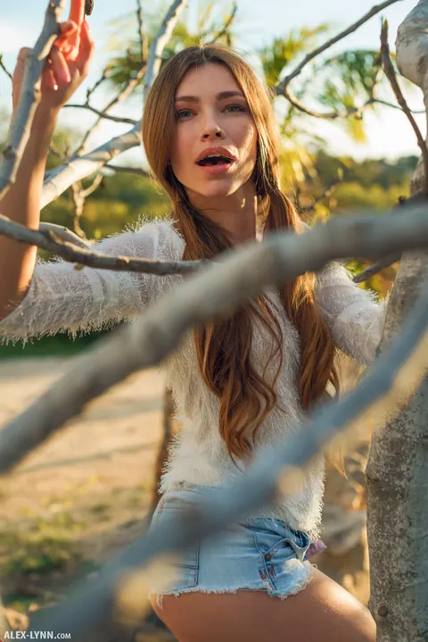 Lyuda: Brunette in Pigtails Pulls Down Her Shorts Outdoors – photo 7 of 17