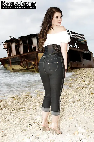 Brunette with Big Natural Tits Strips Out of Her Jeans on the Beach