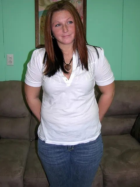 Zoie Starr: Curvy Redhead MILF Strips Out of Her Jeans and Spreads on the Sofa – photo 5 of 20