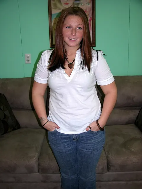 Zoie Starr: Curvy Redhead MILF Strips Out of Her Jeans and Spreads on the Sofa – photo 4 of 20
