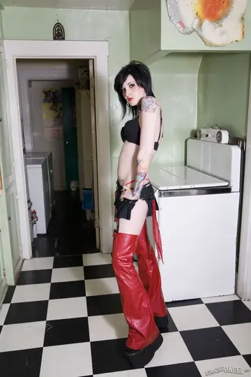 Tattooed Brunette in Costume and Glasses Spreads in the Kitchen