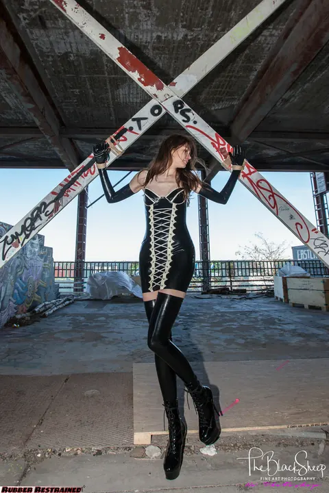 Woman Poses in Latex and Stockings at Abandoned Park – photo 1 of 16