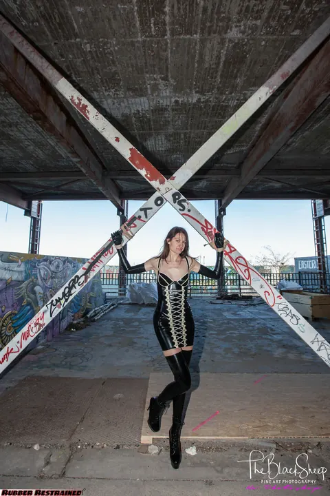 Woman Poses in Latex and Stockings at Abandoned Park – photo 16 of 16