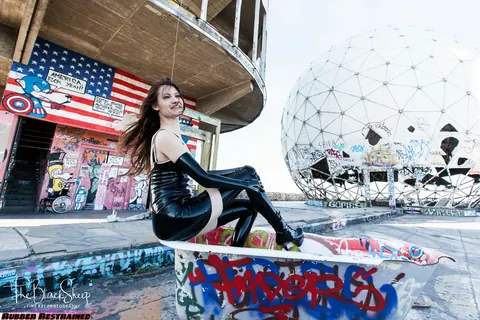 Woman Poses in Latex and Stockings at Abandoned Park – photo 14 of 16