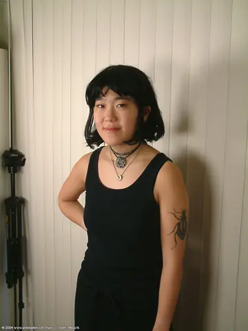 Slim Mature Asian Woman Pulls Down Her Shorts and Spreads Her Hairy Pussy