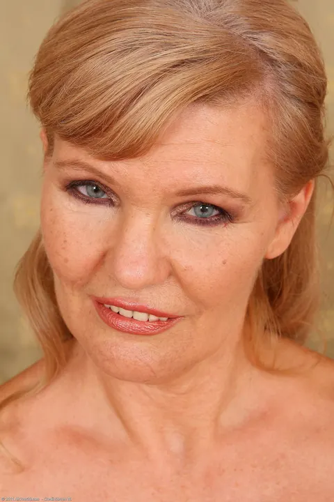 Mature Blonde in White Lingerie Strips and Spreads Her Pussy – photo 6 of 21