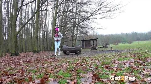 European Woman Pisses in Jeans and Glasses Outdoors – photo 1 of 15