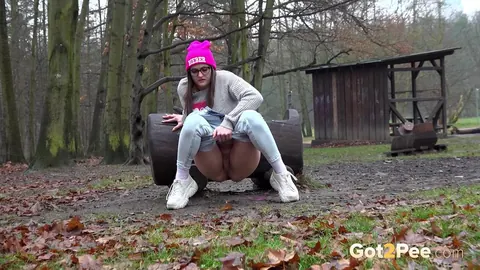 European Woman Pisses in Jeans and Glasses Outdoors – photo 3 of 15