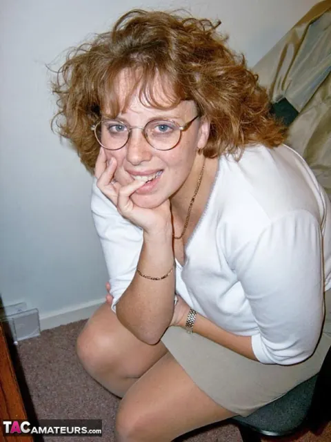 Curvy Claire: British Redhead MILF Poses in Lingerie and Boots at the Office – photo 4 of 20