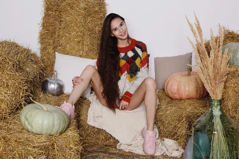 Leona Mia: Skinny Brunette Strips Her Top Off on Straw Bales – photo 3 of 12
