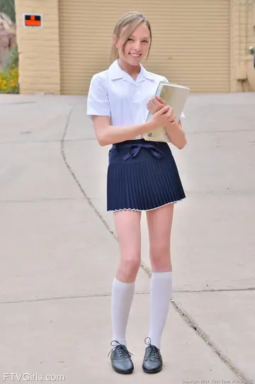 Skinny Blonde Strips Out of Her Skirt and Toys Her Pussy