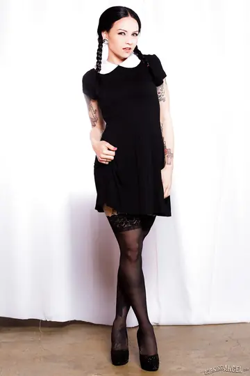 Tattooed Brunette in Pigtails Spreads in Stockings and Garters