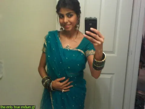 Indian Woman Poses in Boots and Glasses for Bathroom Mirror Selfies – photo 3 of 10