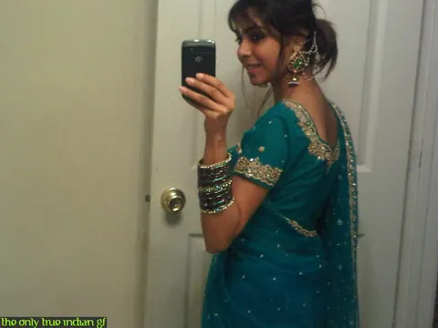 Indian Woman Poses in Boots and Glasses for Bathroom Mirror Selfies – photo 5 of 10