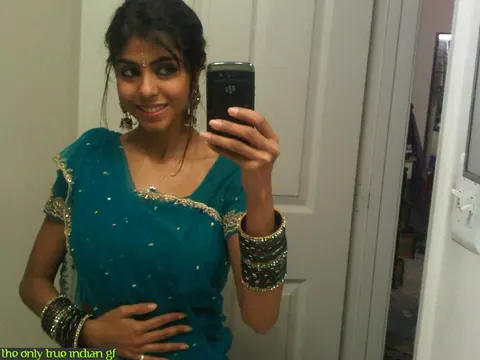 Indian Woman Poses in Boots and Glasses for Bathroom Mirror Selfies – photo 4 of 10