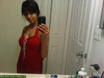 Indian Woman Poses in Boots and Glasses for Bathroom Mirror Selfies