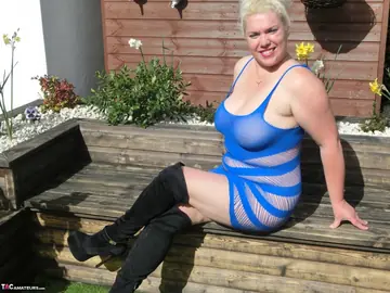 Curvy Blonde MILF in Boots Uses a Wooden Dildo