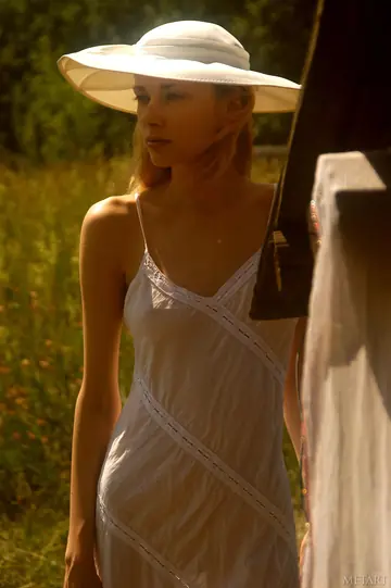 Blonde Strips Nude and Poses Fully Naked