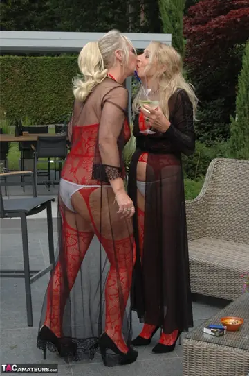 Blonde MILF in Lingerie and Heels Spreads in the Garden