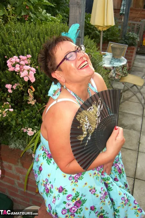Mature BBW Shows Her Big Tits in Stockings on the Backyard Patio – photo 3 of 20