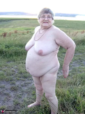 BBW Brunette in Glasses Poses Naked Outdoors