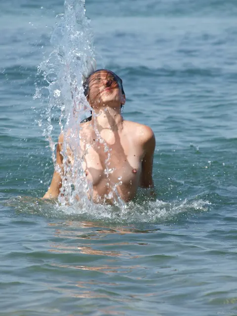 Mature Woman Strips Nude and Spreads on the Beach – photo 20 of 21