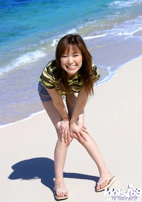 Yua Aida: Japanese Babe with Big Tits Strips Out of Her Shorts on the Beach – photo 2 of 16
