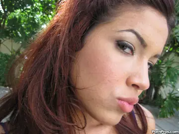 Thick Latina in a Bikini and Glasses Poses Outdoors